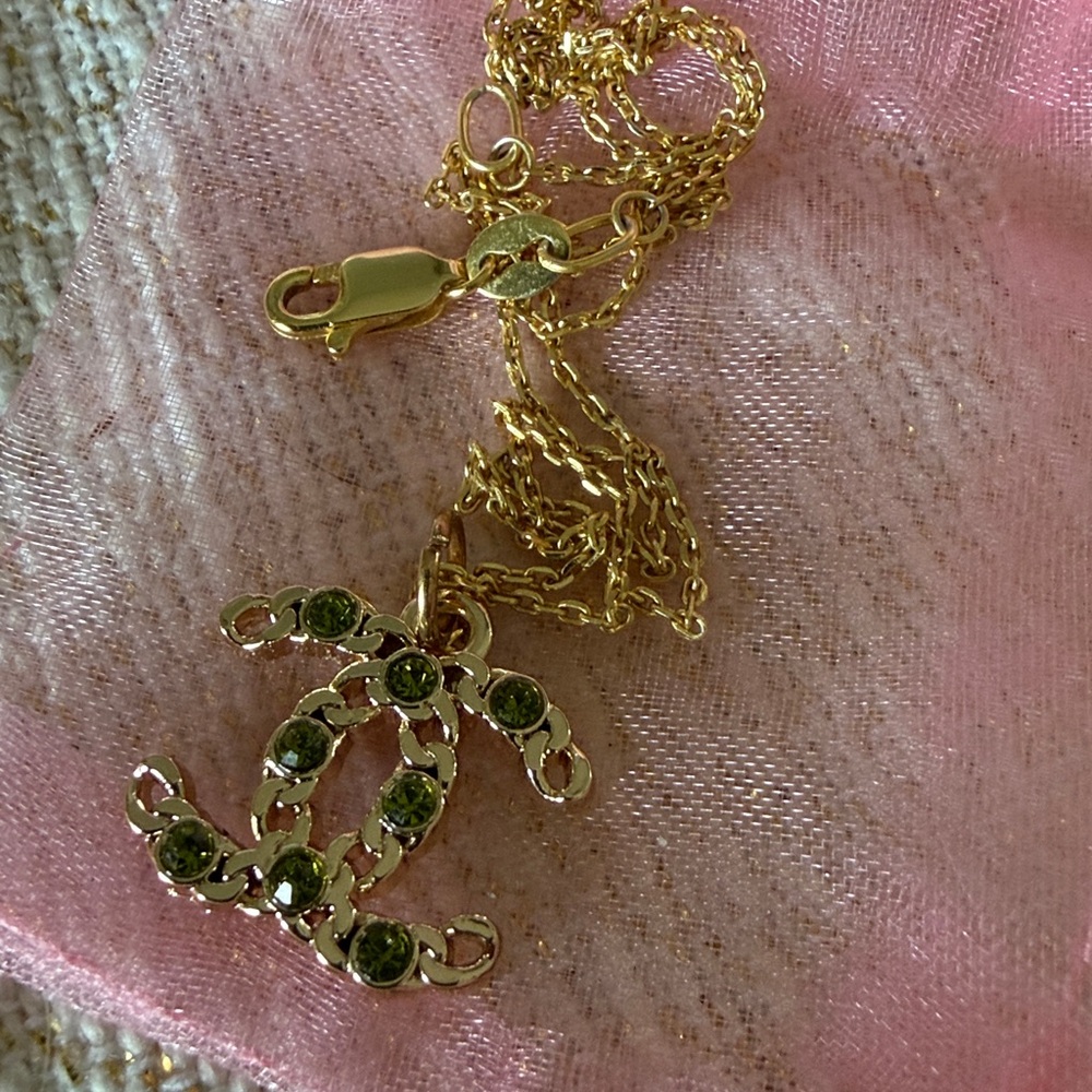 CHANEL Gold Pendant with Green Accents
